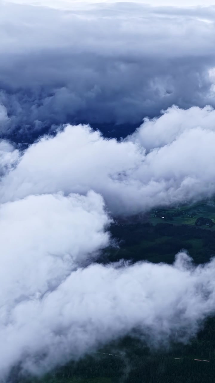 Aerial View Of Dense Clouds Covering A Rural Landscape.