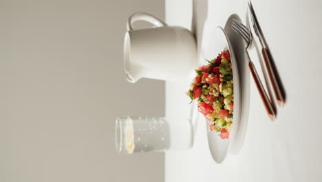 fresh salad with water and jug