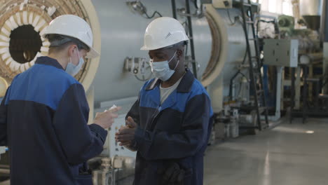 plant shift supervisor disinfecting workers hands