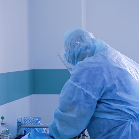 medical worker in safety suit and gloves during pandemic. nurse wears the medical uniform and mask to protect and fight infection from covid-19. coronavirus.