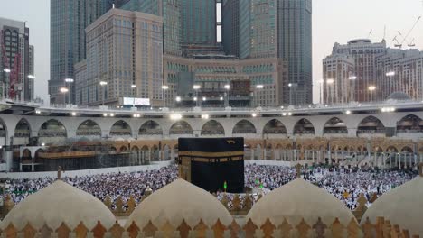 muslim pilgrims circumambulating and pray facing the kaaba