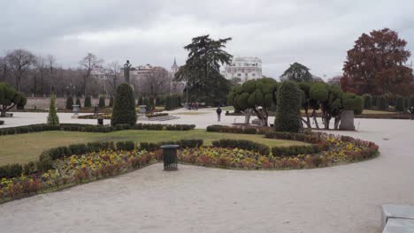 scene with unrecognizable tourists in retiro park, madrid