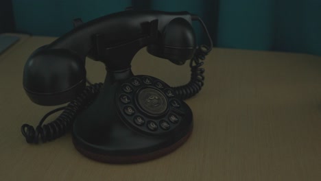 close-up view of a lady waiting for a call from an old telephone