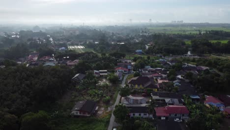 4k-Drone-flying-above-asian-village-houses-at-mid-afternoon-in-melaka