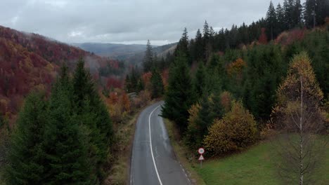 Mountain-Road-Through-The-Forest-In-Autumn-In-Romania