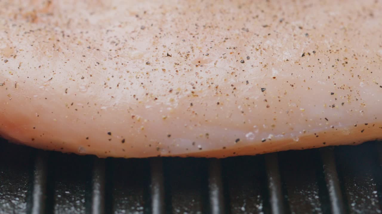 Cooking Seasoned Chicken Fillet on Grill