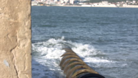 water line draining into the river with the view of the city