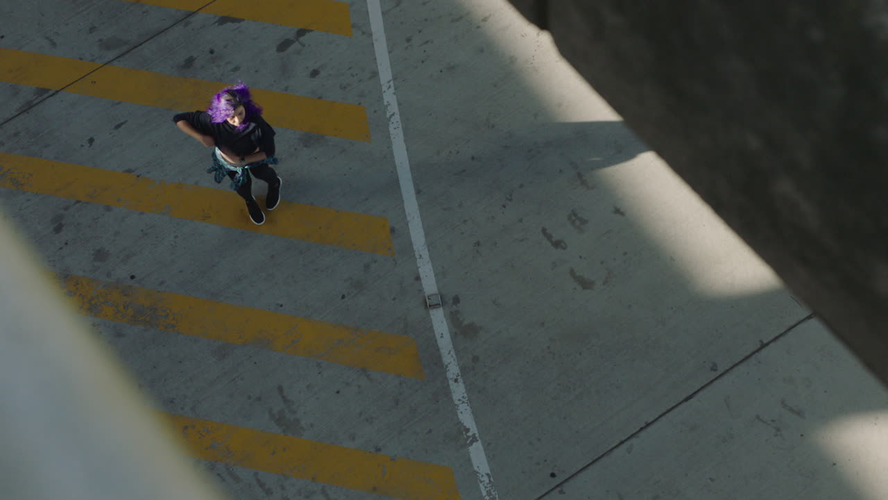 dancing woman young mixed race street dancer with purple hair performing contemporary moves enjoying urban freestyle dance in city top view