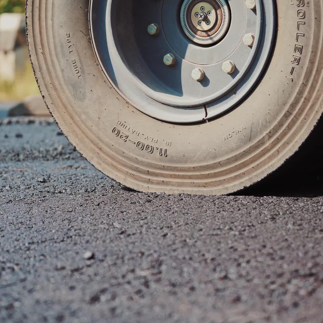 Asphalt spreader in work on site