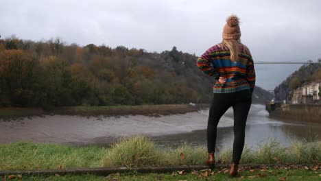 woman enjoying the view of the clifton suspension bridge in bristol, england
