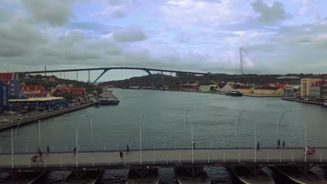 passing over the famous floating bridge of curacao looking onto the juliana bridge