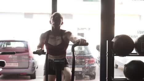 woman working out on exercise bike in a gym