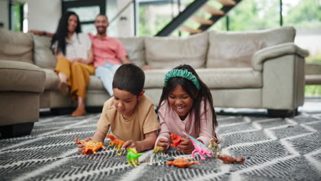 children playing with dinosaurs in living room