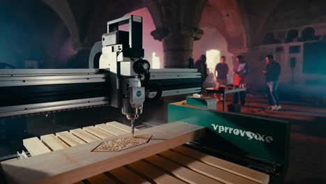 cnc machine carving wood in an atmospheric industrial setting