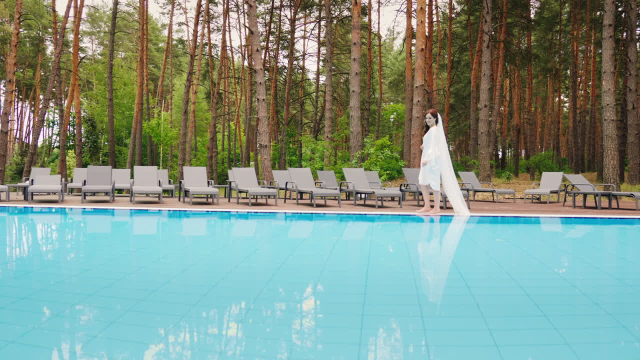 The Bride With A Long Veil Is Walking Around The Pool Wedding In A Luxury Hotel Slow Motion Video
