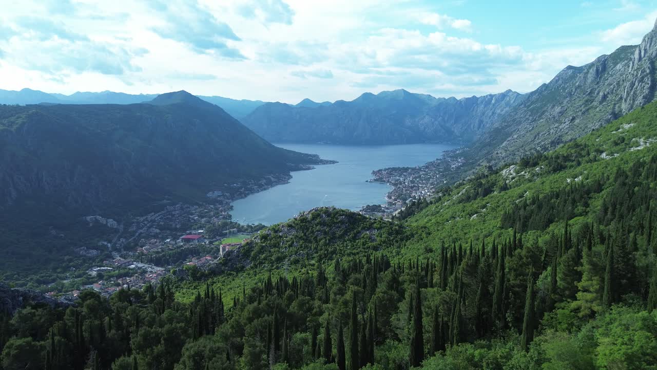 Mountainous and forested landscape surrounding the Bay of Kotor, lush green vegetation and cypress trees, Aerial, Panoramic view