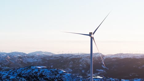 wind power turbines in winter mountains near bessaker, norway