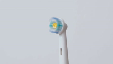 white electric toothbrushes with rotating head on and off