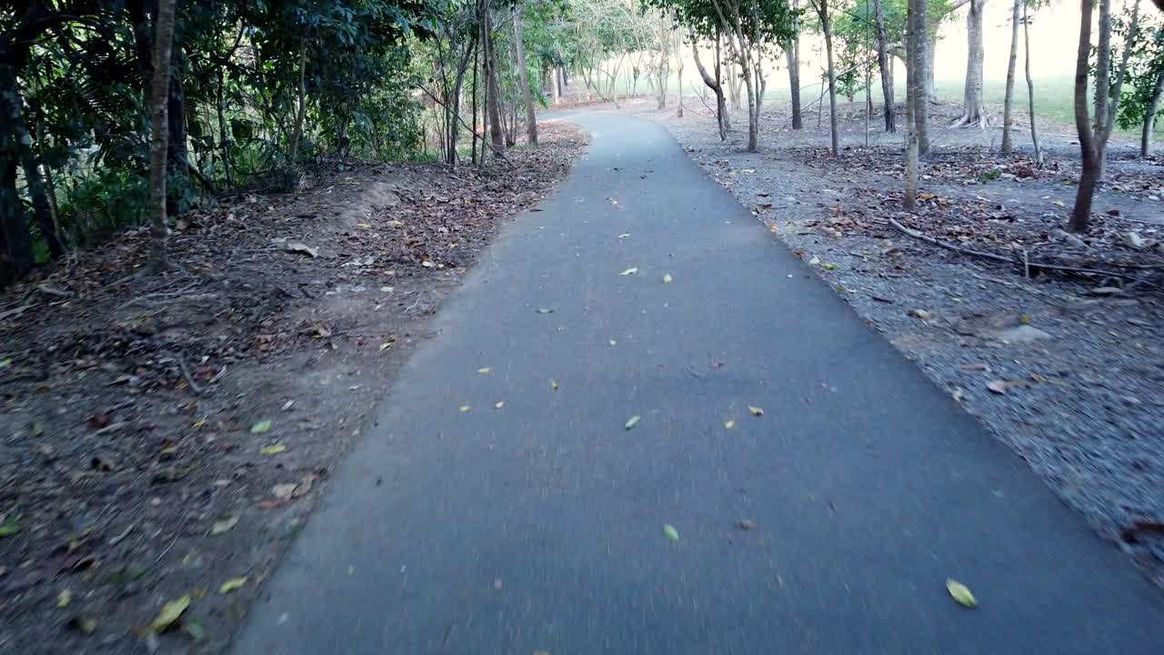 riding down a pathway slow motion leaning into corners