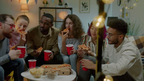 friends enjoying pizza party