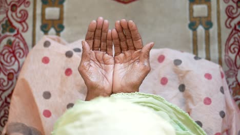 close up of senior women hand praying at ramadan