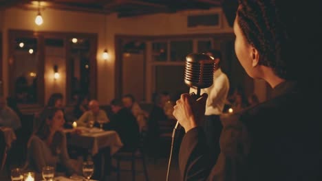 woman singing at a restaurant