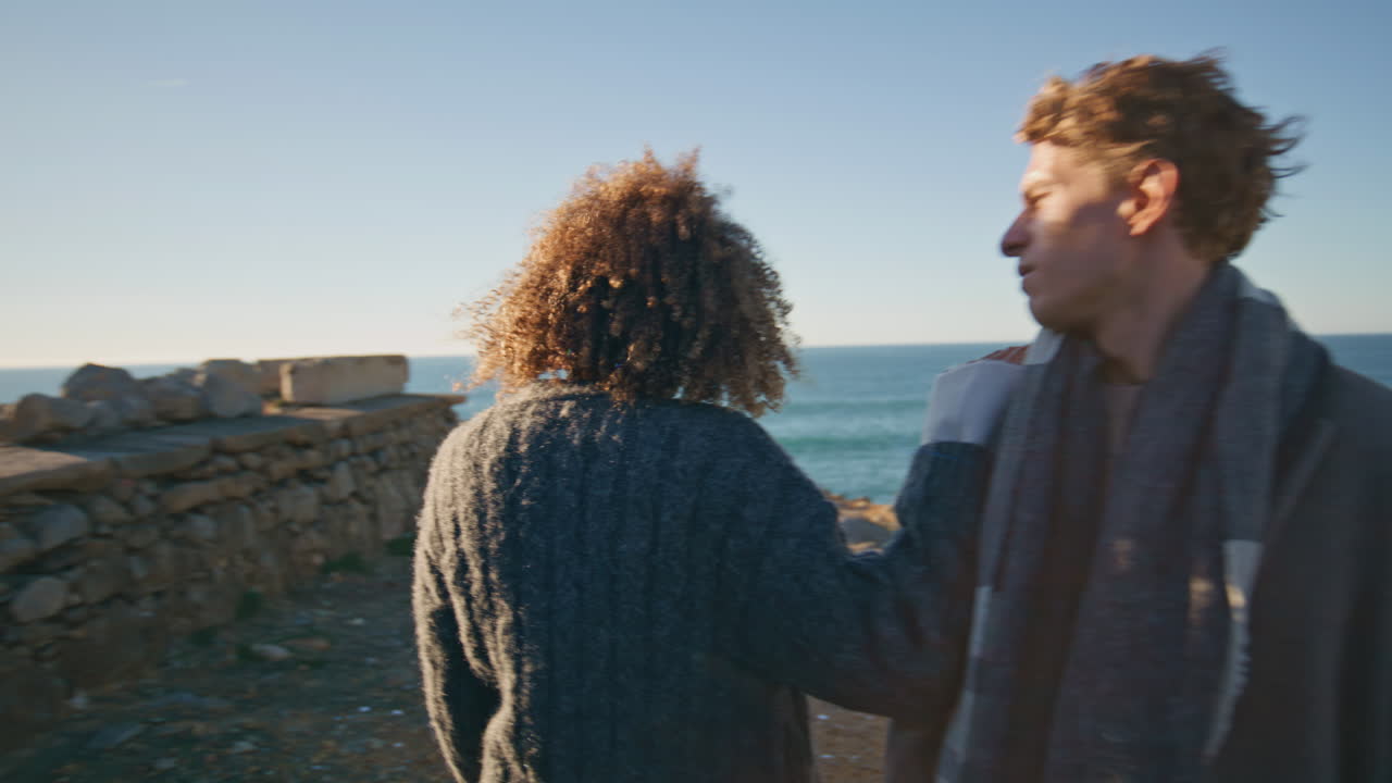 Angry woman going beach at evening closeup. Offended lady pushing boyfriend