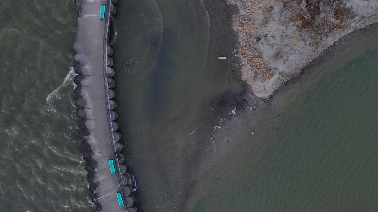 Aerial View of a Serene Dock on a Lake Shore