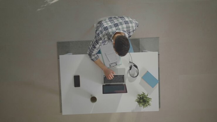 Man sitting, doing some paperwork