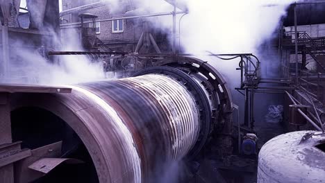 industrial processing plant with smoke and steam