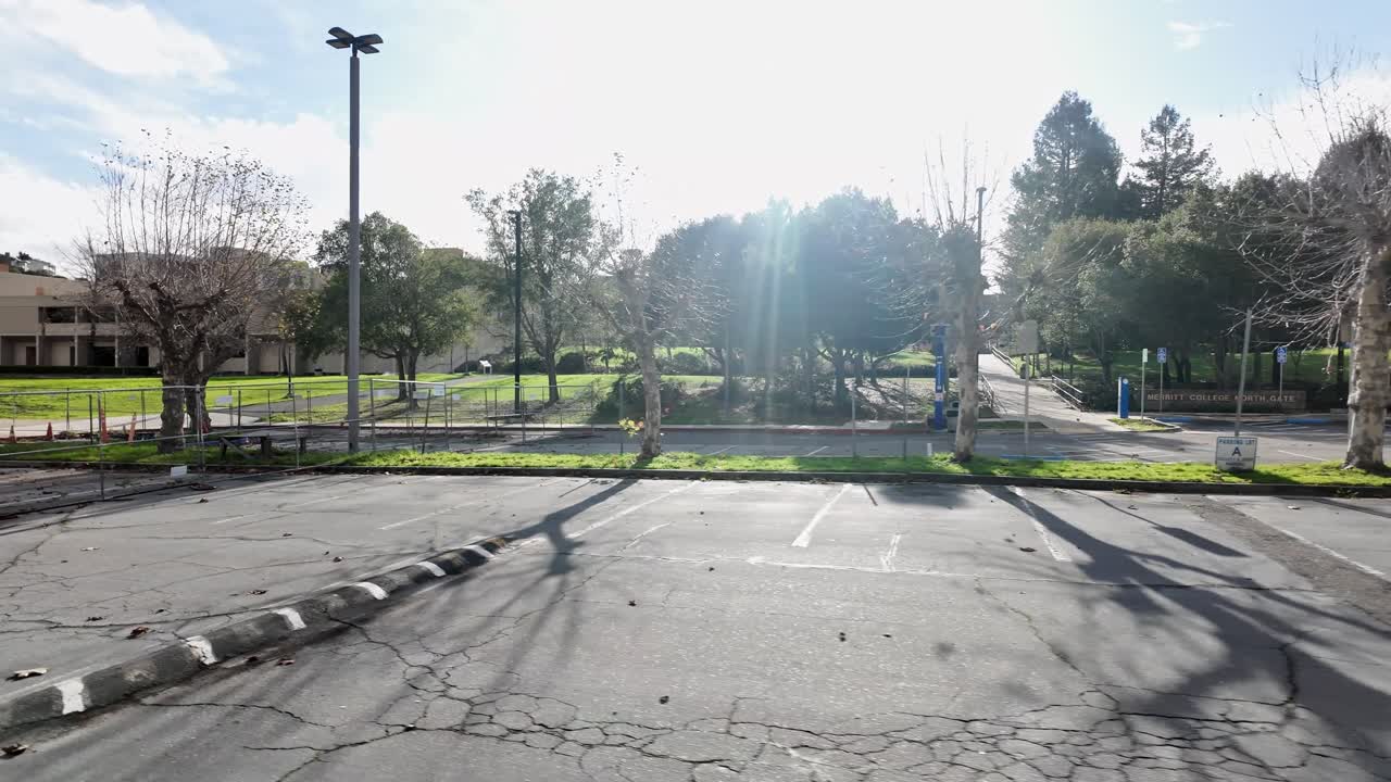 Empty Parking Lot with College Campus on a Sunny Day