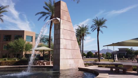 a 30-foot brick fountain stands as a landmark for traffic along a busy roadway, scottsdale, arizona