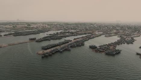 aerial view of fishing boats moored along jetties at ibrahim hyderi in karachi