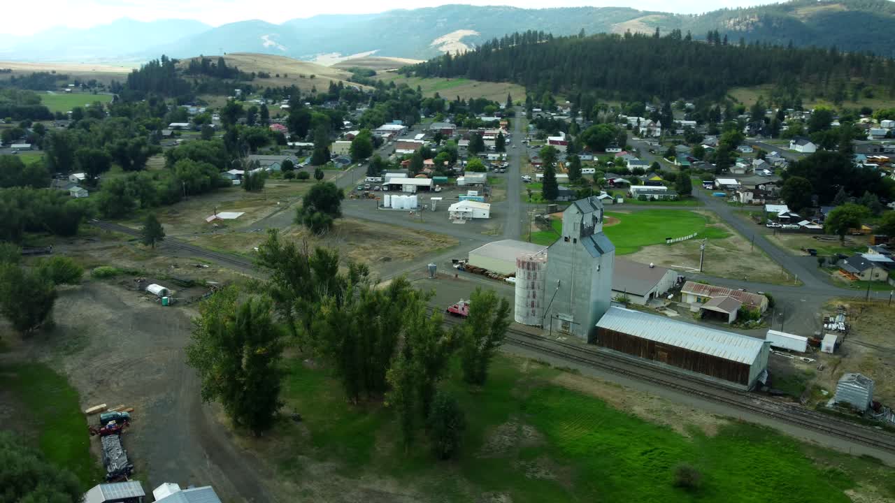 US, Oregon, Wallowa, 2025-08-18 - Drone view of the city of Wallowa, a small farming town in northeast oregon. Orbiting the old grain elevator at the railroad