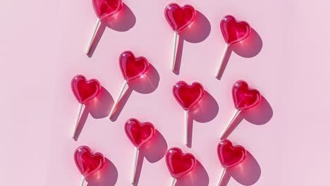 heart lollipops on pink background