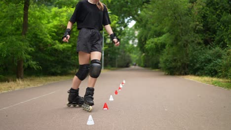 teenage girl rollerblading practice in park