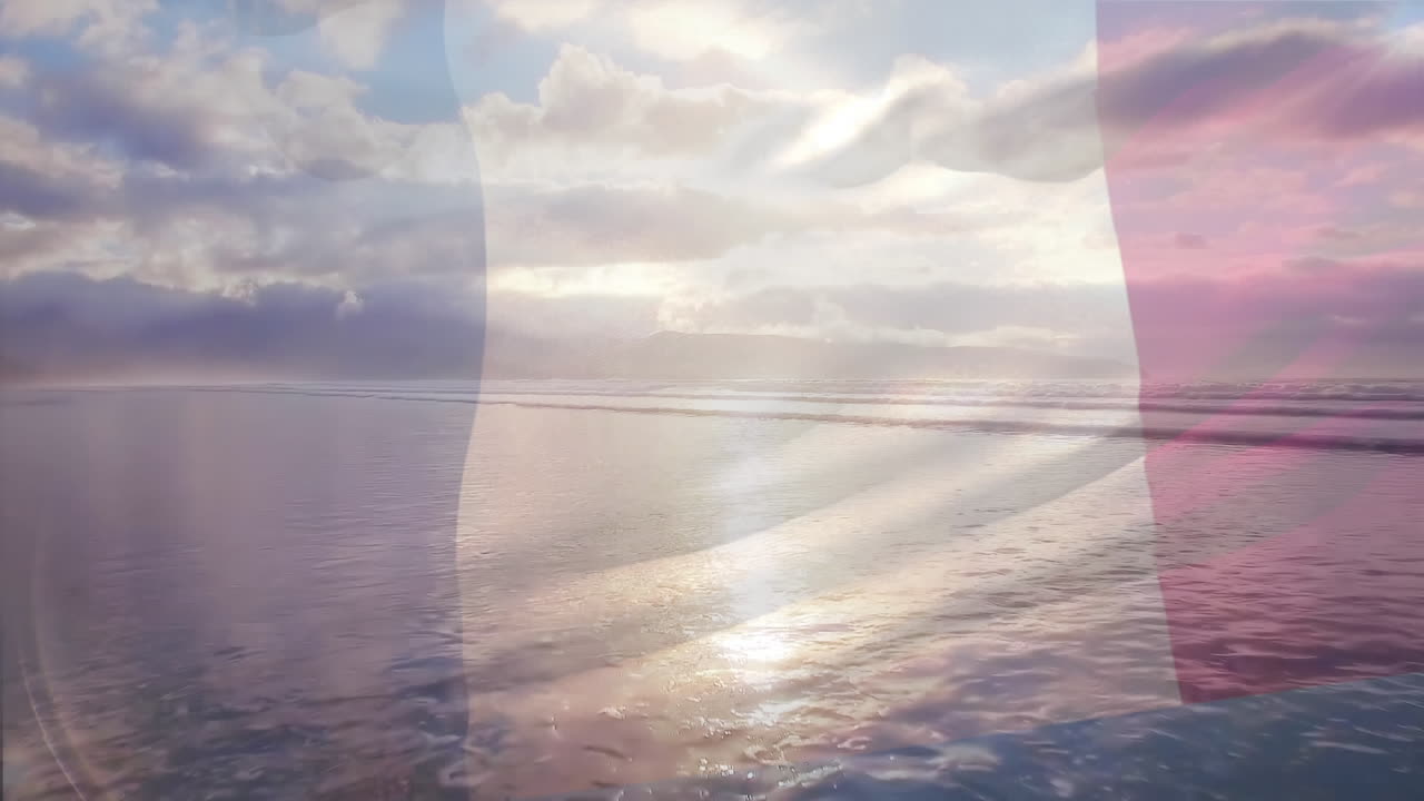 Composizione digitale della bandiera della Germania che sventola sullo sfondo di una vista aerea di onde marine