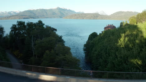 AERIAL---Bridge-over-Correntoso-River,-Neuquen,-Argentina,-forward-reveal