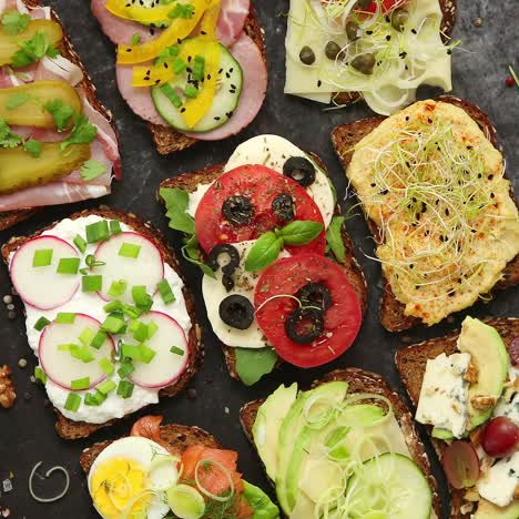 Top-view-of-different-decorated-sandwiches-as-appetizer--Healthy-food--Vegetable-meal