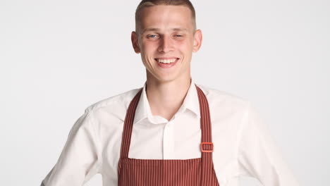 young waiter smiling and posing