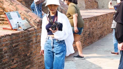 visitors climb steps at historic ayutthaya temple