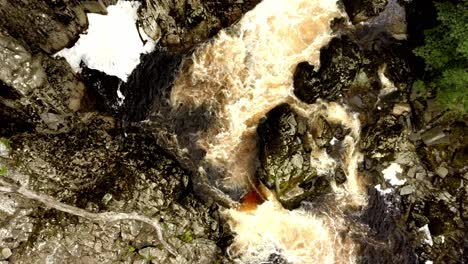 Aerial-view-of-rough-rocky-cascade-like-river