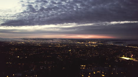 aerial reveal oslo cityscape at dusk view from holmenkollbakken mountain in norway