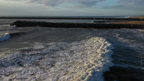 surfing at la barre surf spot sunset aerial shot french basque country anglet