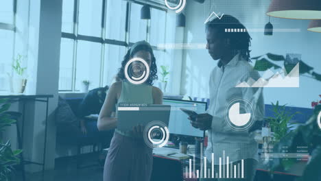 animation of statistical data processing over diverse man and woman discussing over laptop at office