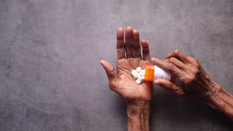 elderly person taking medication