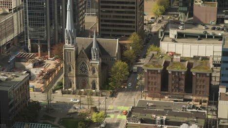 time lapse from above of holy rosary cathedral and surrounding intersections of downtown vancouver, sunny day