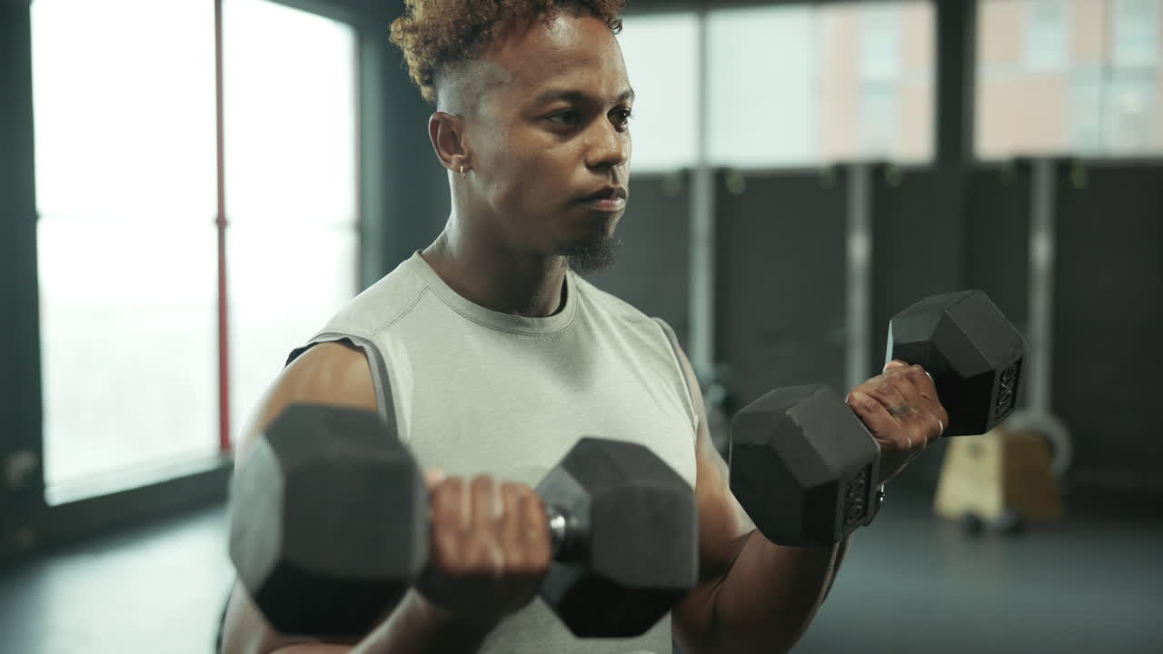 Man doing bicep curls at the gym