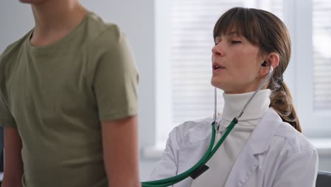 doctor examining a child with a stethoscope