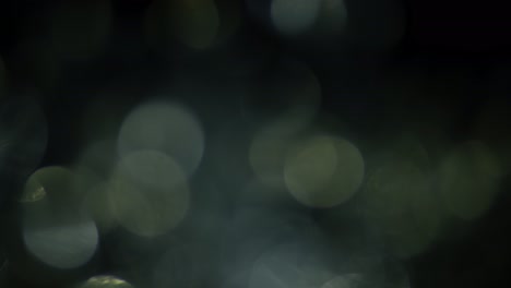 Multicolored light leaks 4k footage on black background. Stylizing video, transitions. Bokeh effect